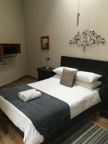 Ένα ή περισσότερα κρεβάτια σε δωμάτιο στο A Sunflower Stop Backpackers