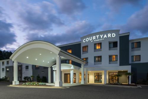 a rendering of a courtyard hotel with a building at Courtyard Mobile Spanish Fort/Eastern Shore in Spanish Fort