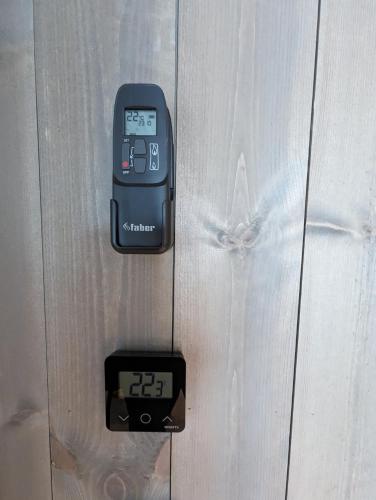 an electronic device is attached to a wooden door at Ski in/out Appartment Hemsedal in Hemsedal