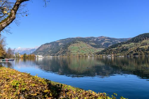 a view of a lake with mountains in the background at Schönblick Residence Apartments - including summer & mobility card in Zell am See