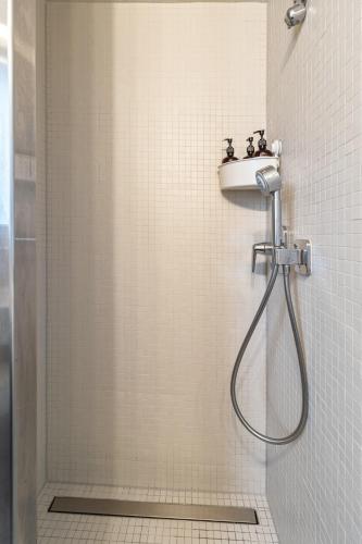 a bathroom with a shower and a sink at Bohème - Home cinéma, Terrasse, Parking & Proche Lac in Estavayer-le-Lac