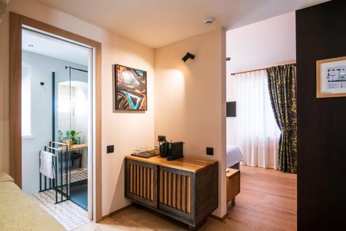 a room with a bed and a mirror at 7oaks Noble House in Dubrovnik