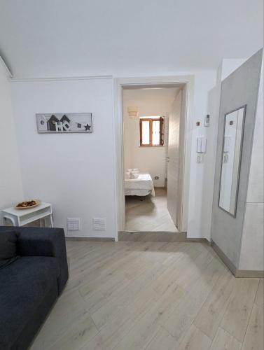 Ένα ή περισσότερα κρεβάτια σε δωμάτιο στο Casa nel borgo della tranquillità