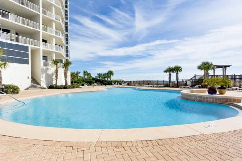 a large swimming pool in front of a building at Palacio Condominiums II in Perdido Key