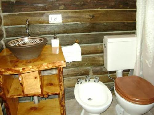 a bathroom with a sink and a toilet at Casal de Morgade in Villa Ciudad Parque