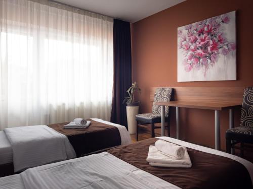 Ένα ή περισσότερα κρεβάτια σε δωμάτιο στο Zlatna Ribica