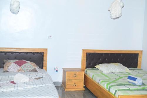 Postel nebo postele na pokoji v ubytování Akagera Neighbors