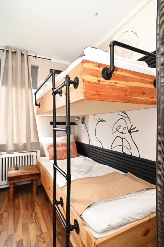 a bunk bed room with two bunk beds at Self check in City Hostel Nordstern in Essen
