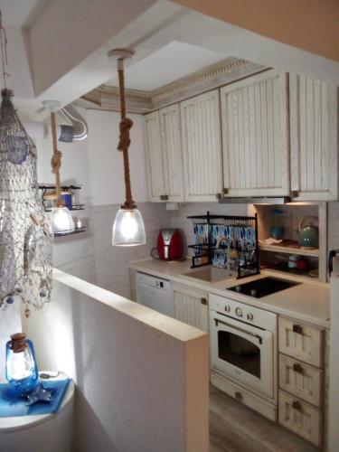 Kuchyň nebo kuchyňský kout v ubytování Apartment Mediterraneo Seagull