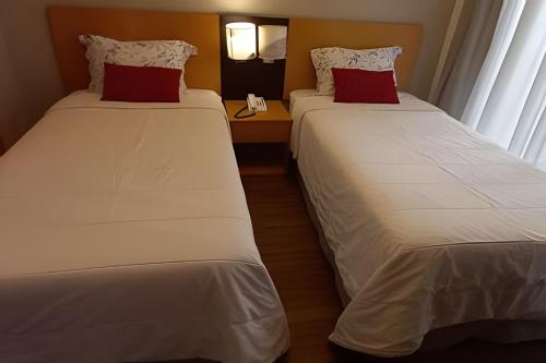 En eller flere senge i et værelse på Get a Flat 1402 Ibirapuera-Jardins-Paulista