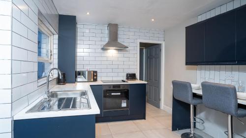 a kitchen with a sink and a counter top at 1 BDR apartment at QUEENS UNI by Belfast City Breaks in Belfast