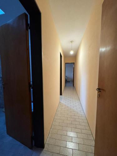 an empty hallway with a hallway leading to a hallwayasteryasteryasteryasteryasteryastery at Departamento Fragata - Alto Alberdi in Cordoba