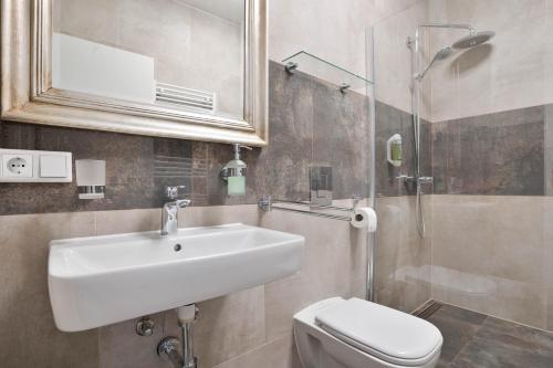 a bathroom with a sink and a toilet and a shower at Stilvolle Apartments in Bonn I home2share in Bonn