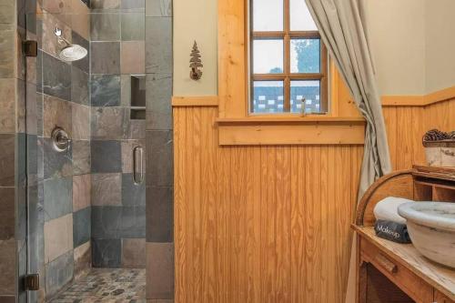 a bathroom with a shower and a sink at Quiet Getaway at Wayward Cottage in Pisgah