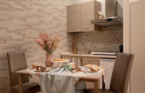 a kitchen with a table with food on it at Domus Cuomo B&B in Nocera Inferiore