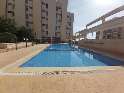 a large swimming pool in front of a building at Plaza Mayor in Calpe