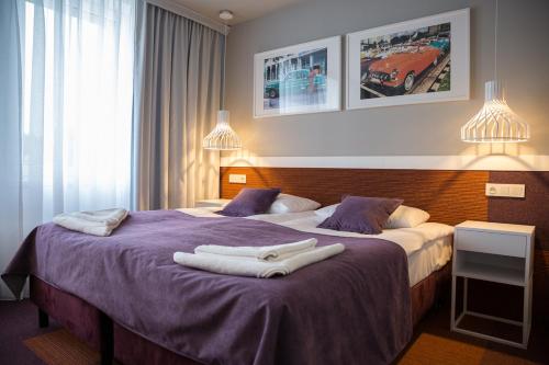 Postelja oz. postelje v sobi nastanitve Hotel Quattro Weekend