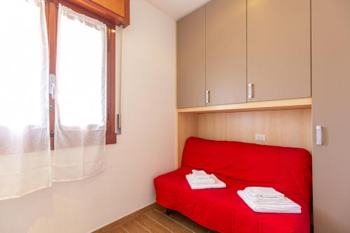 Postel nebo postele na pokoji v ubytování Prestige Garda Home - La Madonnina