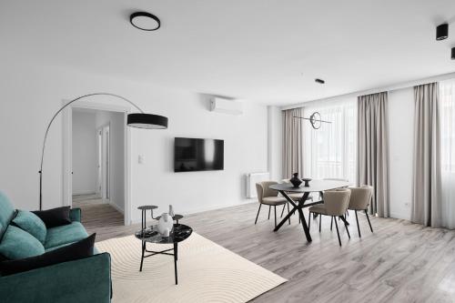 a living room with a couch and a table at Hotel Collect & Residence in Budapest