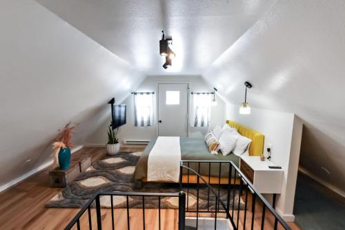 a living room with a bed and a couch at Boho Modern Retreat with Mountain Views Unit 1 Durango in Durango