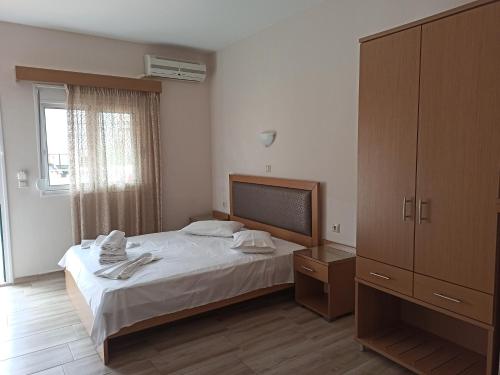 Postel nebo postele na pokoji v ubytování VILLA ANESTIS