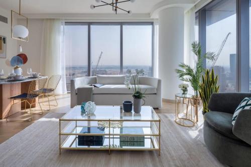 a living room with a couch and a table at Frank Porter - Boulevard Point in Dubai