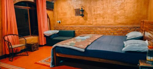 Katil atau katil-katil dalam bilik di Angels Nest Home stay 2 Acra private plantation Mountain area balconey SunRice view Nearby Ngarhole wild life , Tholpetty wild life , Pakshipathalam Bird santuary , Kuruva island # Thirunelly & Thrissilery Temple Near by Secure Stay Wayanad Kerala