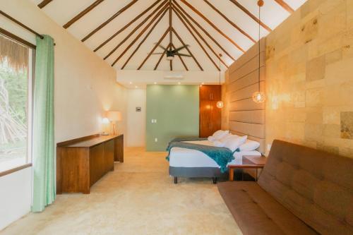 Postel nebo postele na pokoji v ubytování Mayan Playa Bacalar