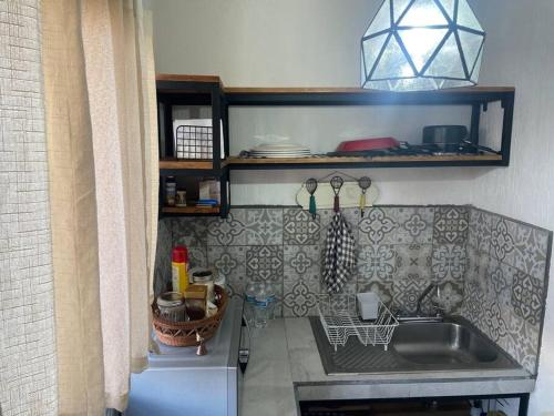 a kitchen with a sink and a counter top at Casa Azul in San Miguel in San Miguel de Allende