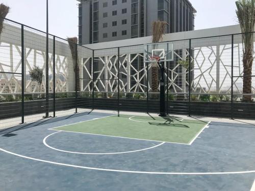 a basketball court with a net and a basketball hoop at Frank Porter - Bella Rose in Dubai