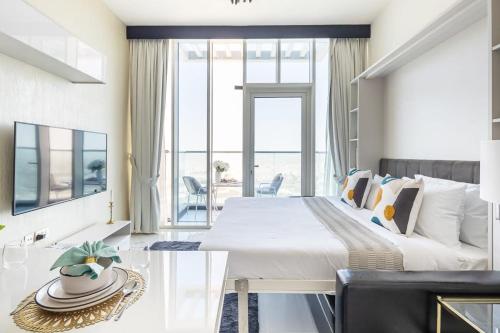 a bedroom with a large bed and a large window at Frank Porter - Miraclz by Danube in Dubai