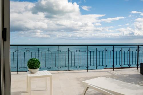 a balcony with a view of the ocean at BLU MARINE in Catanzaro