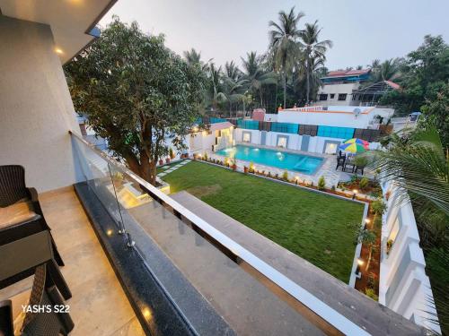 an overhead view of a swimming pool in a house at Basil Leaf Resort in Alibag