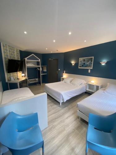 Postel nebo postele na pokoji v ubytování Hotel Le Pelican