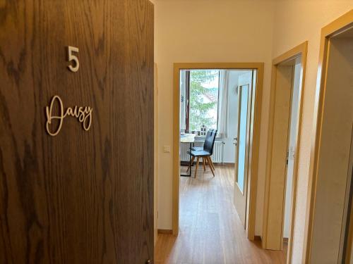 a hallway with a number sign on a wall at Ferienwohnung Daisy in Sankt Andreasberg