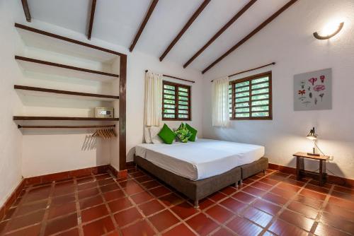 a bedroom with a bed in a room at La Mello Country House in Palomino