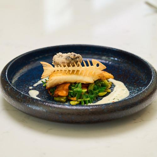 a blue plate of food with a fish on it at The g Hotel & Spa in Galway