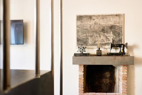 a fireplace in a room with a picture on the wall at 21 Lake Sweet Home in Como