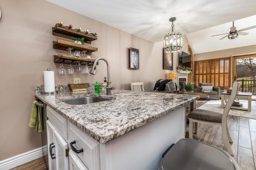 a kitchen with a sink and a counter at Golfers Valleywood Getaway, The Galena Territory in Galena