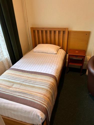 Ένα ή περισσότερα κρεβάτια σε δωμάτιο στο Hotel 24