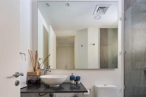 a bathroom with a white sink and a mirror at Frank Porter - Springs 12 in Dubai