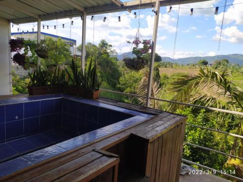 a hot tub on the balcony of a house at Apto Tipo Cabaña Cerca aeropuerto (PEI) in Pereira