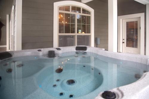 a jacuzzi tub in a house at 30-Day Min Near Lake and Downtown Whitefish in Whitefish