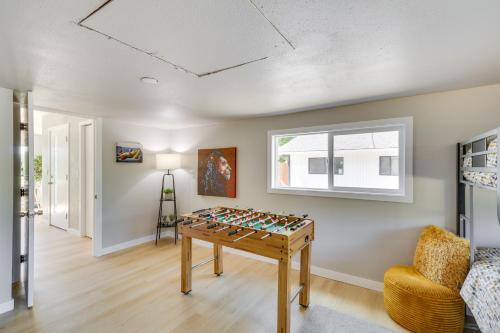 a room with a table with a game at Chehalis Getaway with Golf Course View and Fire Pit! in Chehalis