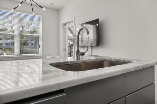 a kitchen with a sink and a window at New Building Downtown Atlanta Condo in Atlanta