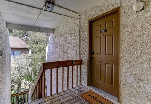 a front door of a house with a porch at Beach Escape, 1 block from the Beach in Fernandina Beach