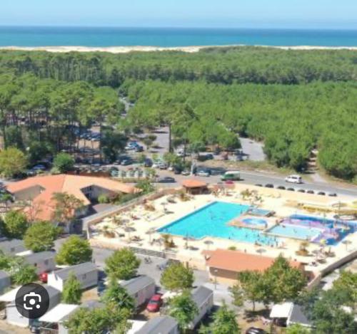 an aerial view of a resort with a swimming pool at Mobile Home Village Vacances Océan et Nature in Seignosse