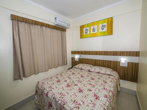 سرير أو أسرّة في غرفة في Lacqua's diRoma I, II, III, IV ou V
