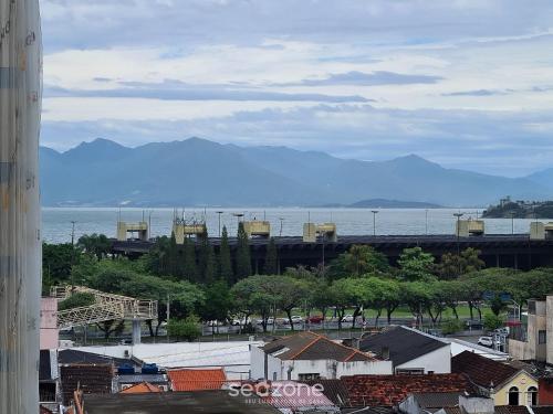 a view of a city with a train on a bridge at Aptos modernos no centro de Floripa - VLR in Florianópolis