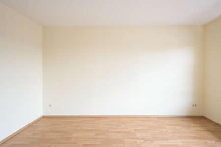 an empty room with white walls and a wooden floor at El Establo in Arequipa